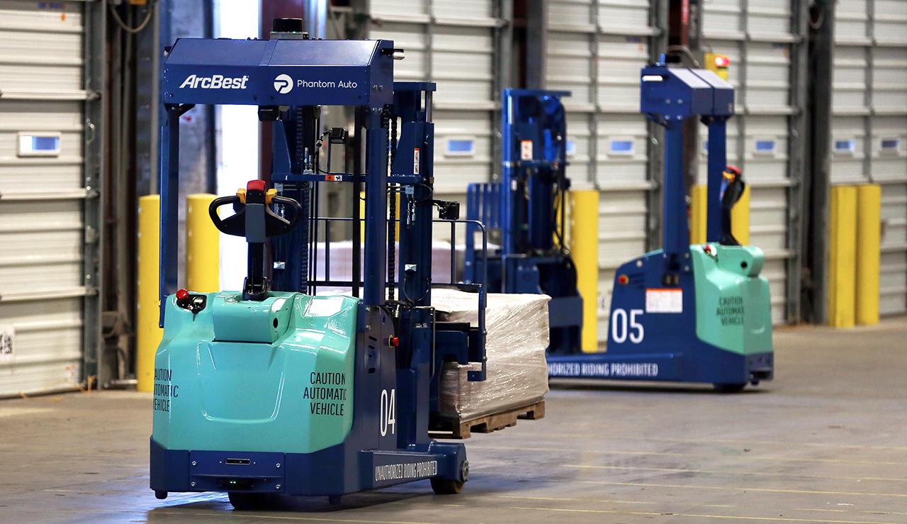 Remote-operated autonomous forklifts developed with Phantom Auto for use in ArcBest customer locations, pictured in the ArcBest R&D lab.
