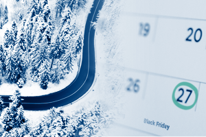 Road with snow around it next to a calendar with Black Friday’s date circled
