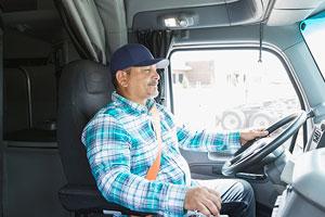 Owner Operator driving tractor trailer