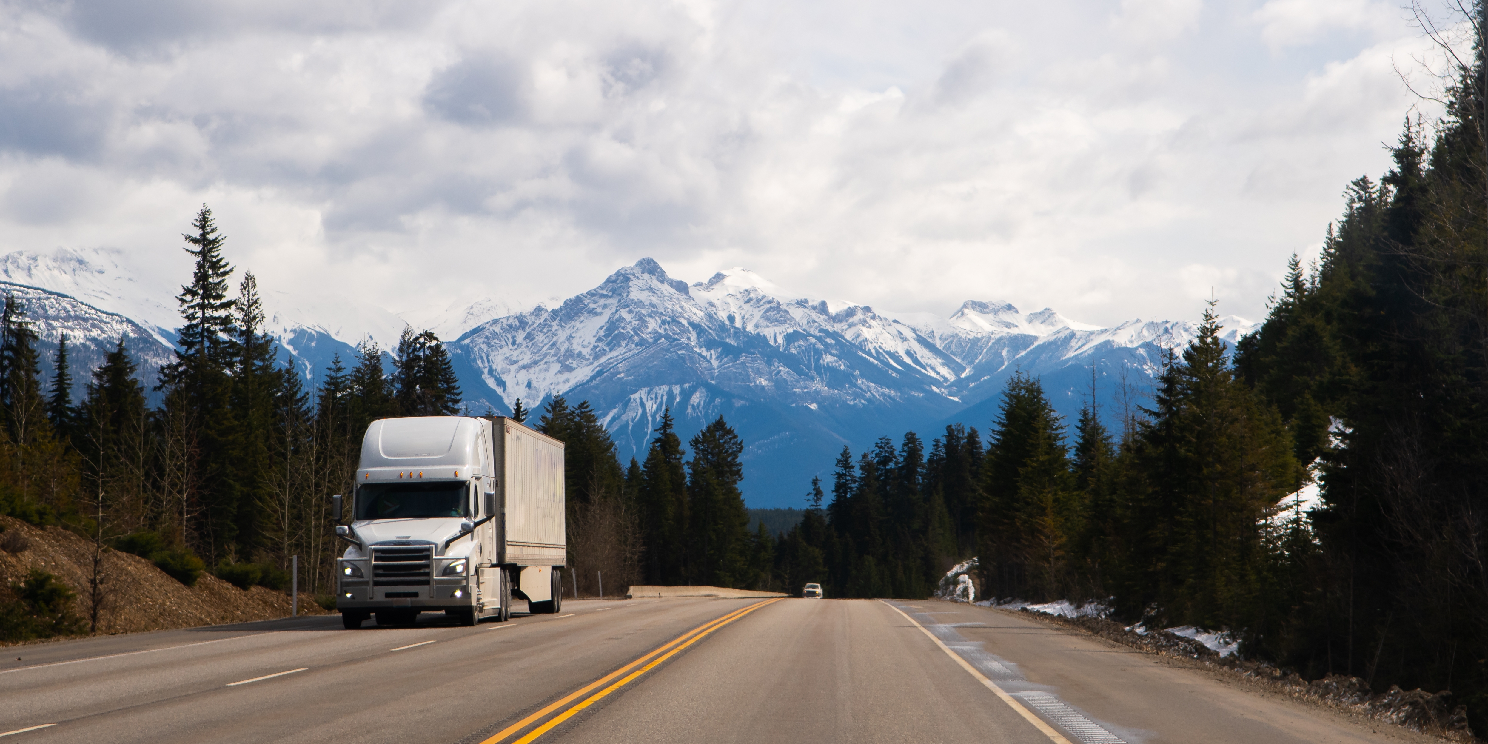 White truck driving through British Columbia
