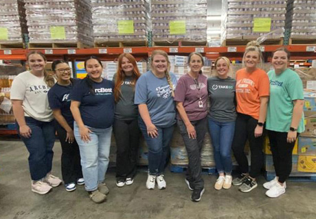 ArcBest Customer Solutions Team serving at food bank 