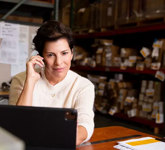 Business executive on phone planning new product line launch