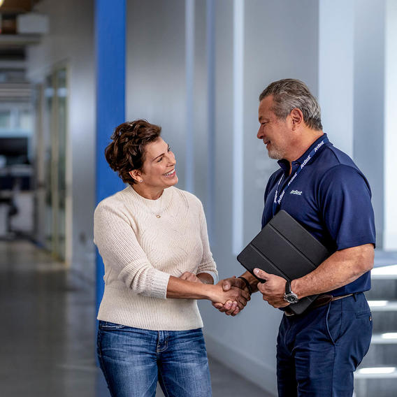 Woman shaking hands with an ArcBest account manager.