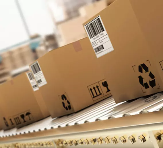 Boxes on a conveyer belt getting ready to be shipped.