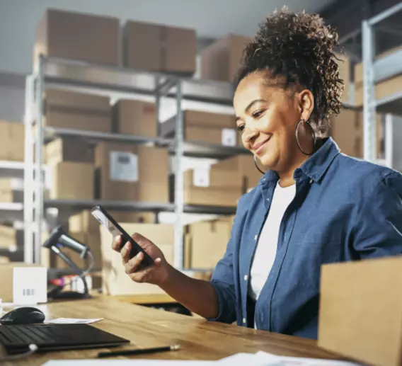 Woman booking a freight shipment online.