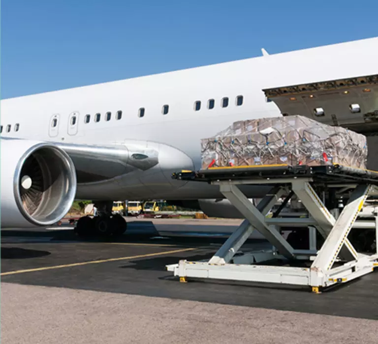 Cargo being loaded into the side of a plane.