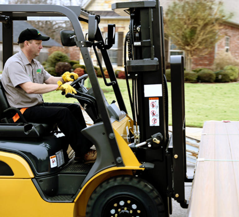 ABF employee driving a forklift. 