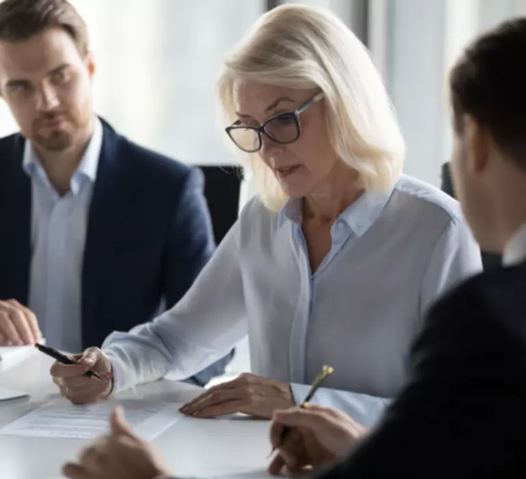 Woman leading business meeting.