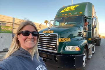[Brianna Wasko] Brianna Wasko, the first female named to the 2023-2024 ABF Road Team, poses outside an ABF truck. 