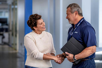 Woman shaking hands with an ArcBest account manager.