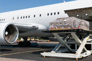 Cargo being loaded into the side of a plane.