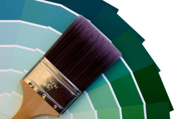 Paintbrush and a fan of paint color swatches.