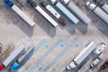 parked semi-trucks in a parking lot