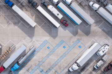 parked semi-trucks in a parking lot