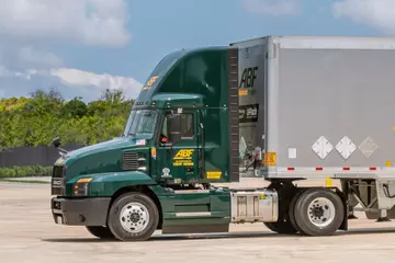 ABF Freight truck parked in a lot.