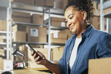 Woman booking a freight shipment online.