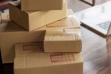 Packages stacked up to return after the holidays.