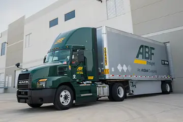 ABF truck in a loading zone at a warehouse.