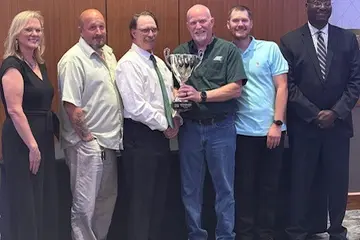 ABF Freight drivers and team members with the Michigan TDC team trophy