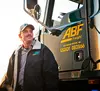 Driver standing in front of ABF Freight truck door