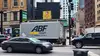 ABF equipment parked on a busy city street