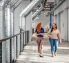 ArcBest employee walks down a hallway with a customer